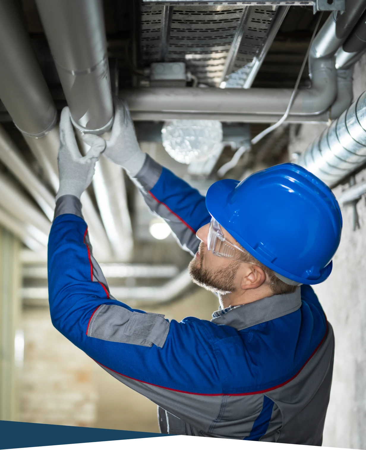 Engineer fixing industrial pipes