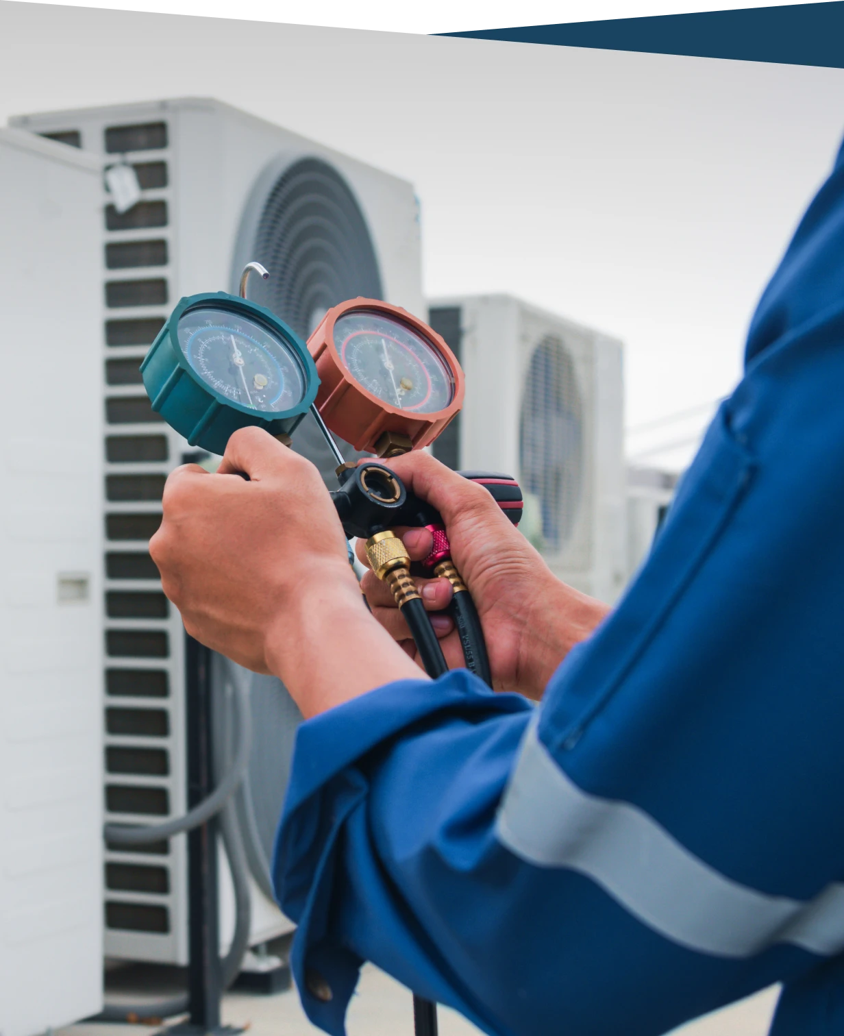 Technician checking HVAC system gauges