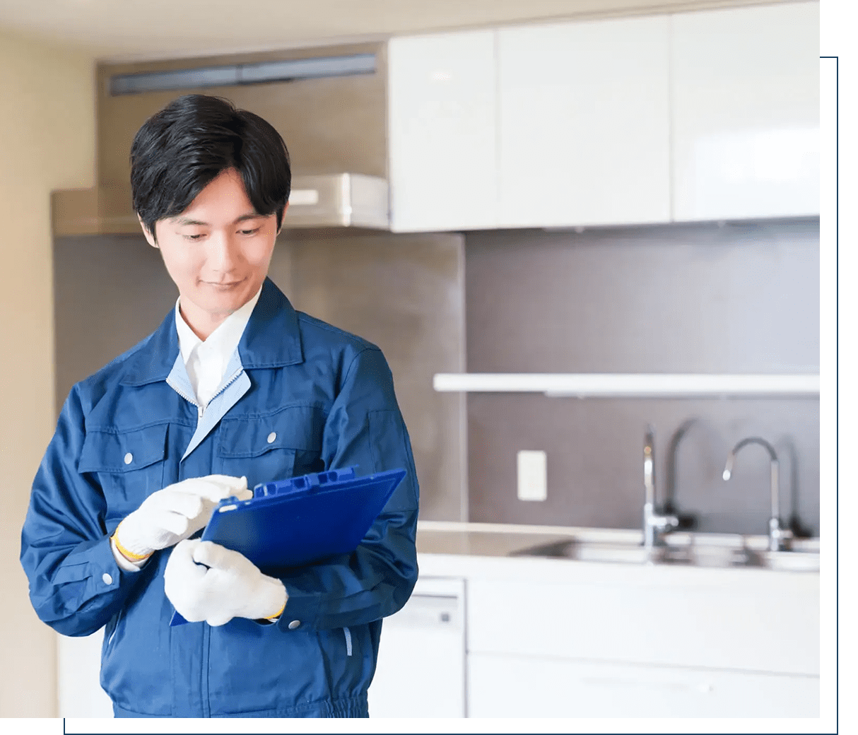 Worker inspecting a blue item in a kitchen.